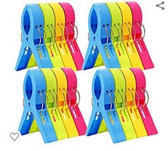 Towel clips for securing a towel on a windy cruise ship pool deck